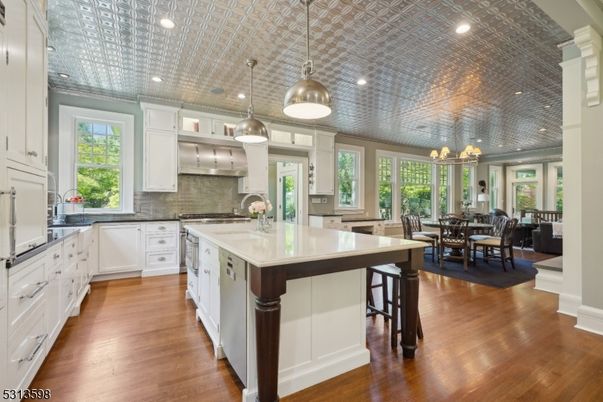 Chandelier, Dining room, Interior, Kitchen, Pendant Lights, Recessed Lighting, Stainless Steel Appliances, Wood Texture Flooring