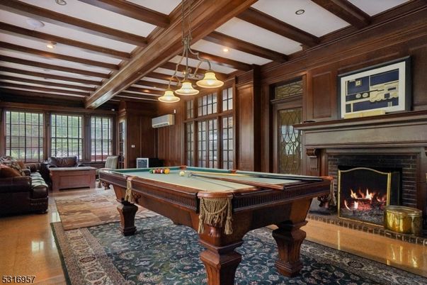 Billiard Table, Chandelier, Fireplace, Game Room, Interior, Living room, Pendant Lights, Recessed Lighting, Wooden Beams, Wood Texture Flooring, Wooden Walls