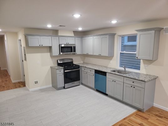 Interior, Kitchen, Recessed Lighting, Stainless Steel Appliances, Wood Texture Flooring