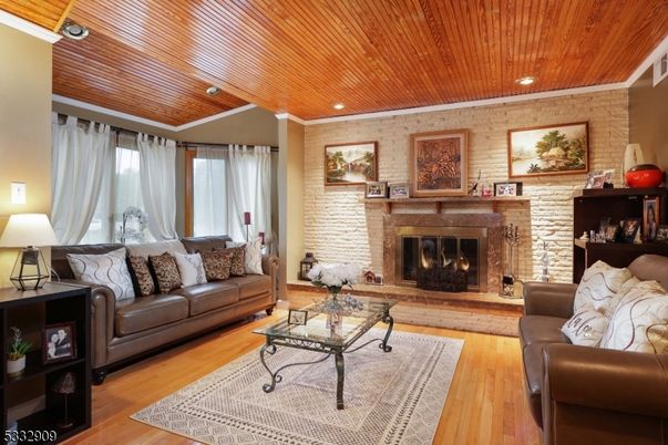 Fireplace, Interior, Living room, Recessed Lighting, Stone Walls, Wooden Ceilings, Wood Texture Flooring