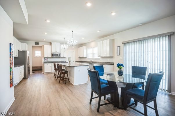 Chandelier, Dining room, Interior, Kitchen, Pendant Lights, Recessed Lighting, Wood Texture Flooring