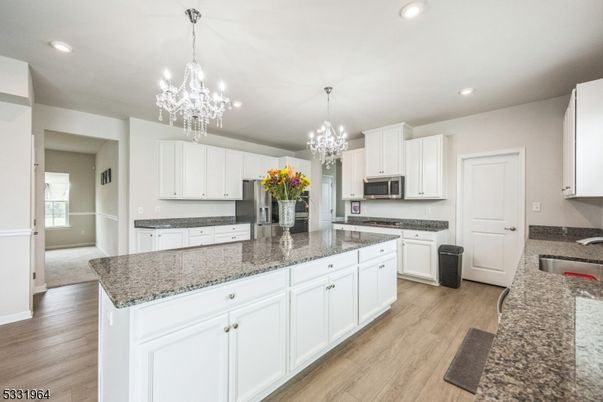 Chandelier, Interior, Kitchen, Pendant Lights, Recessed Lighting, Stainless Steel Appliances, Wood Texture Flooring