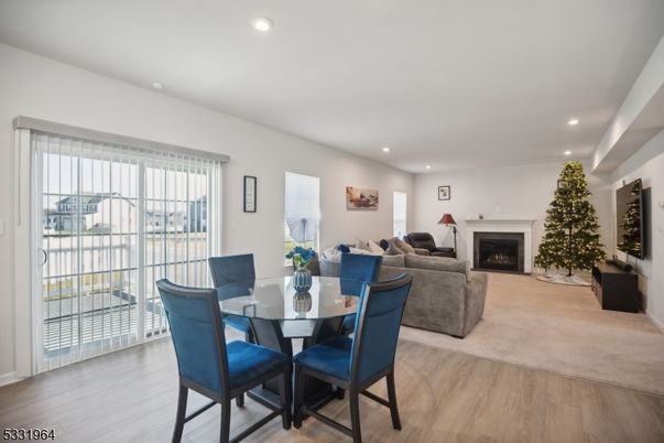 Dining room, Fireplace, Interior, Living room, Recessed Lighting, Wood Texture Flooring