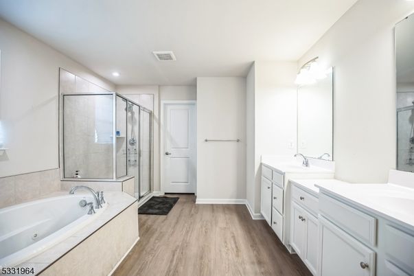 Bathroom, Dual Sink Vanities, Glass Shower, Interior, Recessed Lighting, Wood Texture Flooring