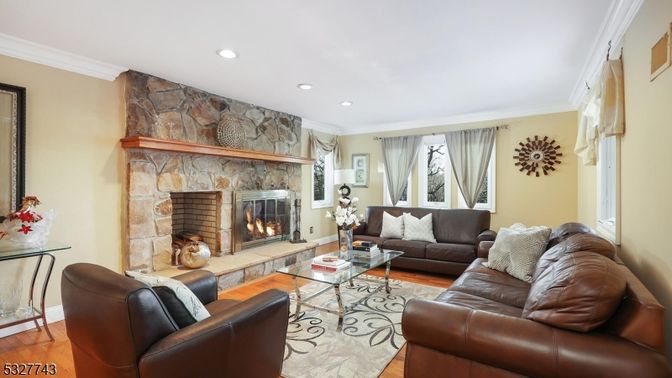 Fireplace, Interior, Living room, Recessed Lighting, Stone Walls, Wood Texture Flooring