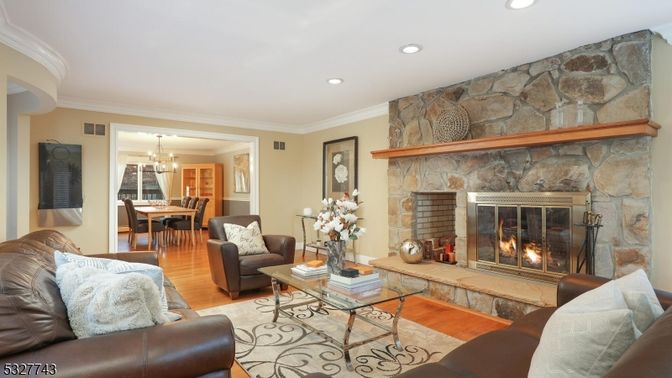 Chandelier, Dining room, Fireplace, Interior, Living room, Recessed Lighting, Stone Walls, Wood Texture Flooring