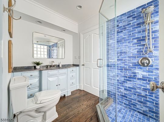 Bathroom, Glass Shower, Interior, Recessed Lighting, Tile Countertops, Wood Texture Flooring