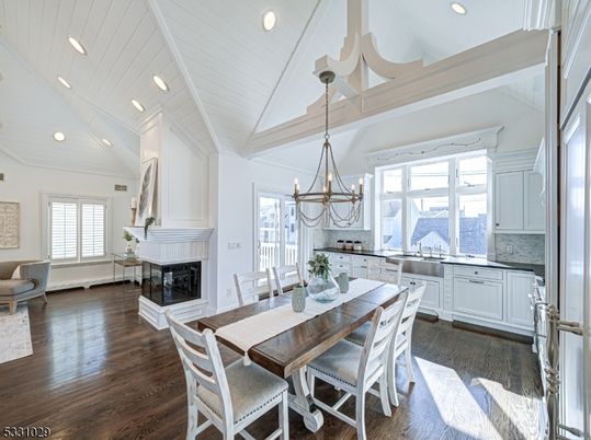 Chandelier, Dining room, Fireplace, Interior, Kitchen, Pendant Lights, Recessed Lighting, Wood Texture Flooring
