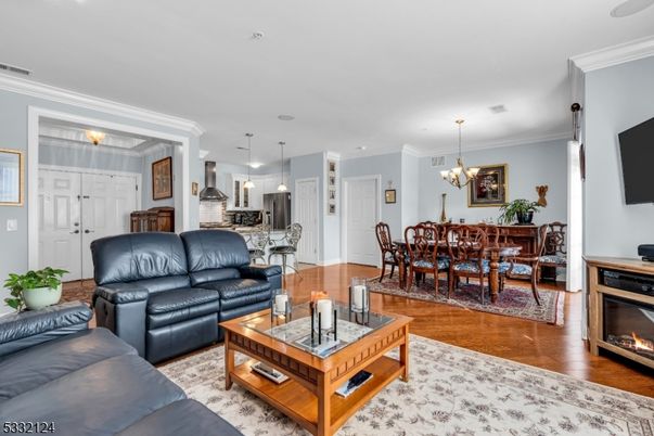 Chandelier, Dining room, Fireplace, Interior, Kitchen, Living room, Pendant Lights, Recessed Lighting, Wood Texture Flooring