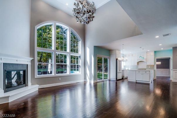 Chandelier, Empty room, Fireplace, Interior, Kitchen, Pendant Lights, Recessed Lighting, Wood Texture Flooring
