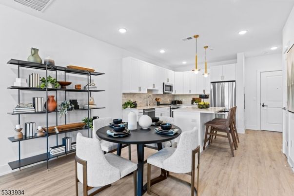 Dining room, Interior, Kitchen, Pendant Lights, Recessed Lighting, Stainless Steel Appliances, Wood Texture Flooring