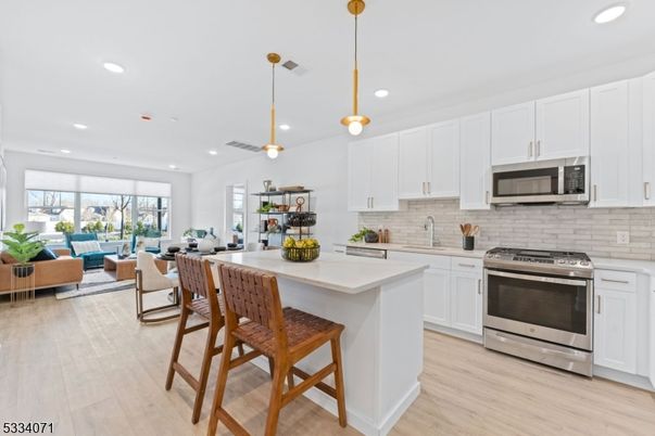 Interior, Kitchen, Living room, Pendant Lights, Recessed Lighting, Stainless Steel Appliances, Wood Texture Flooring