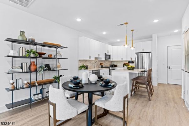 Dining room, Interior, Kitchen, Pendant Lights, Recessed Lighting, Stainless Steel Appliances, Wood Texture Flooring