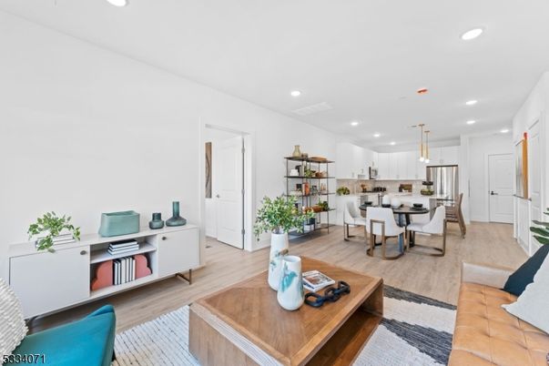 Dining room, Interior, Kitchen, Living room, Pendant Lights, Recessed Lighting, Stainless Steel Appliances, Wood Texture Flooring