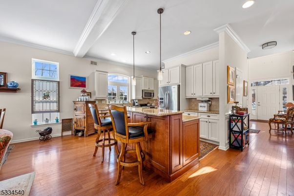 Dining room, Interior, Kitchen, Pendant Lights, Recessed Lighting, Stainless Steel Appliances, Wood Texture Flooring