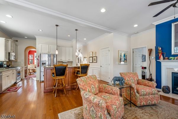 Fireplace, Interior, Kitchen, Living room, Pendant Lights, Recessed Lighting, Stainless Steel Appliances, Wood Texture Flooring