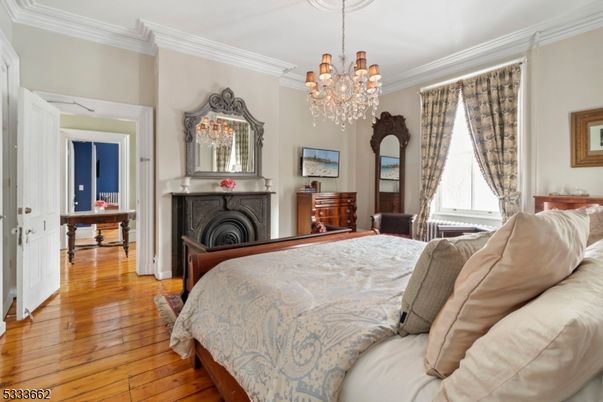Bedroom, Chandelier, Fireplace, Interior, Wood Texture Flooring