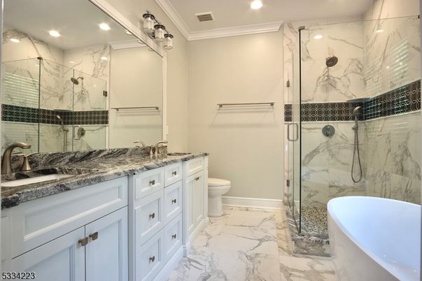 Bathroom, Dual Sink Vanities, Free Standing Baths, Glass Shower, Interior, Marble, Marble Walls, Recessed Lighting