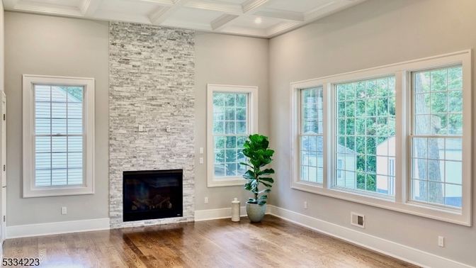 Empty room, Fireplace, Interior, Recessed Lighting, Stone Walls, Wood Texture Flooring
