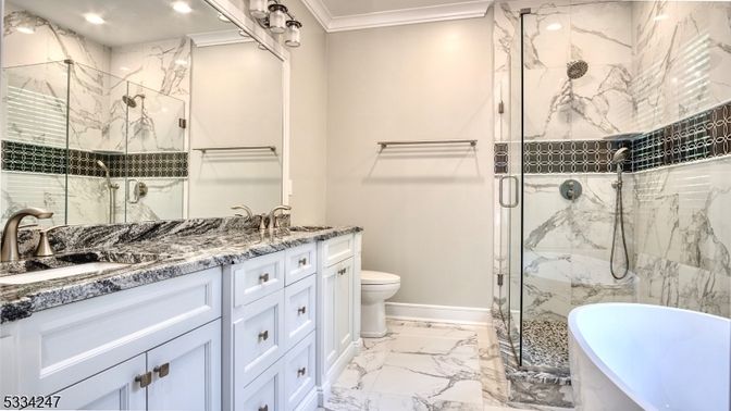 Bathroom, Dual Sink Vanities, Free Standing Baths, Glass Shower, Interior, Marble, Marble Walls, Recessed Lighting