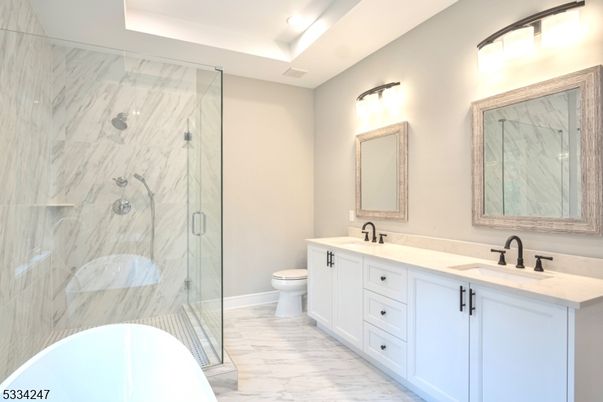 Bathroom, Dual Sink Vanities, Free Standing Baths, Glass Shower, Interior, Marble, Marble Walls, Recessed Lighting