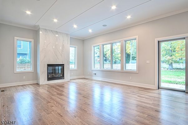Empty room, Fireplace, Interior, Marble Walls, Recessed Lighting, Wood Texture Flooring