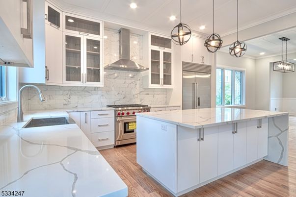 Interior, Kitchen, Marble Walls, Pendant Lights, Recessed Lighting, Stainless Steel Appliances, Wood Texture Flooring