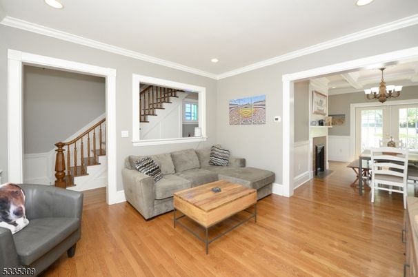 Chandelier, Dining room, Fireplace, Interior, Living room, Recessed Lighting, Wood Texture Flooring