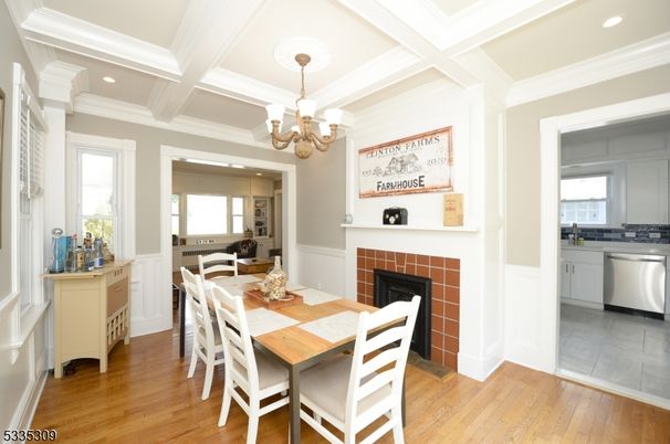 Chandelier, Dining room, Fireplace, Interior, Kitchen, Recessed Lighting, Wood Texture Flooring