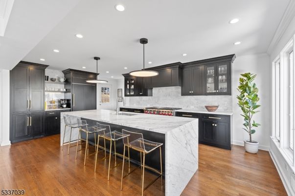 Interior, Kitchen, Marble Walls, Pendant Lights, Recessed Lighting, Stainless Steel Appliances, Wood Texture Flooring