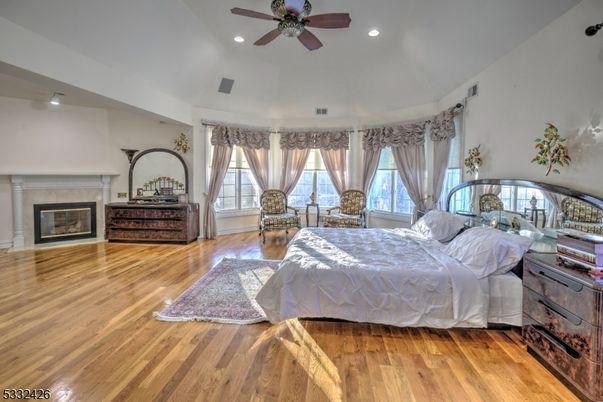 Bedroom, Fireplace, Interior, Recessed Lighting, Wood Texture Flooring