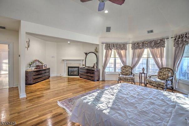 Bedroom, Fireplace, Interior, Recessed Lighting, Wood Texture Flooring