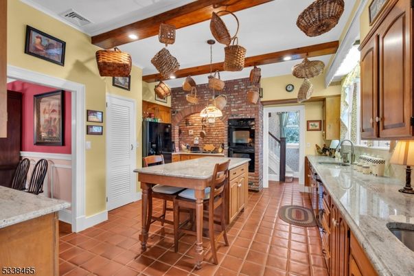 Interior, Kitchen, Pendant Lights, Recessed Lighting, Stainless Steel Appliances, Stone Walls, Wooden Beams