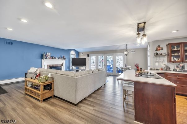 Dining room, Fireplace, Interior, Kitchen, Living room, Pendant Lights, Recessed Lighting, Wood Texture Flooring