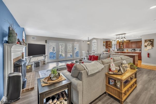Dining room, Fireplace, Interior, Kitchen, Living room, Pendant Lights, Recessed Lighting, Wood Texture Flooring
