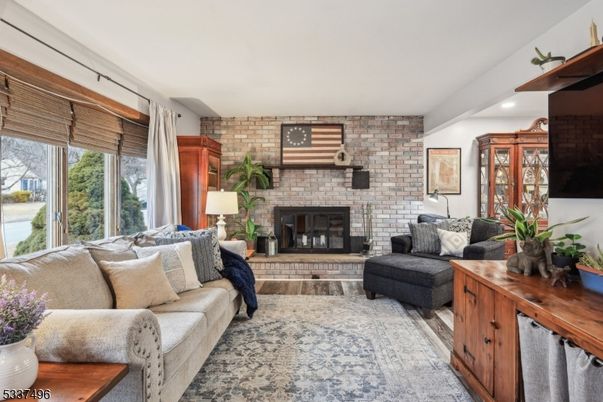 Fireplace, Interior, Living room, Recessed Lighting, Stone Walls, Wood Texture Flooring