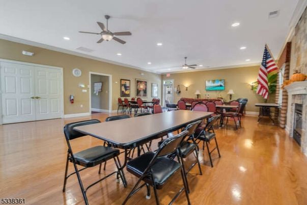 Dining room, Fireplace, Interior, Living room, Recessed Lighting, Wood Texture Flooring