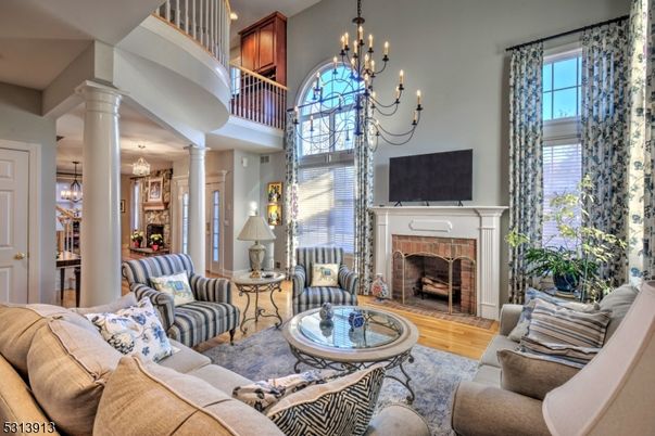 Chandelier, Dining room, Fireplace, Interior, Living room, Pendant Lights, Recessed Lighting, Wood Texture Flooring