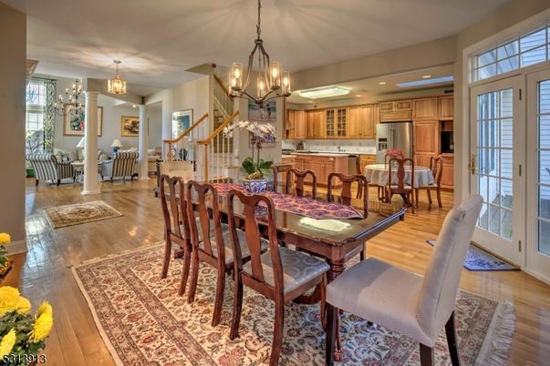 Chandelier, Dining room, Interior, Kitchen, Recessed Lighting, Stainless Steel Appliances, Wood Texture Flooring