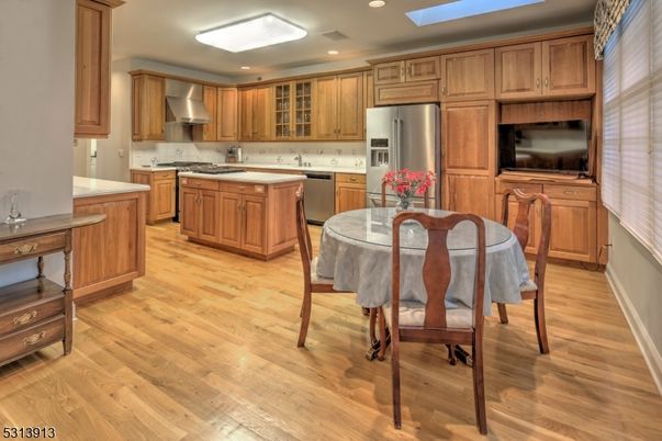 Dining room, Interior, Kitchen, Recessed Lighting, Stainless Steel Appliances, Wood Texture Flooring