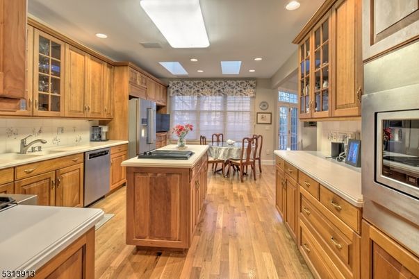 Dining room, Interior, Kitchen, Recessed Lighting, Stainless Steel Appliances, Wood Texture Flooring