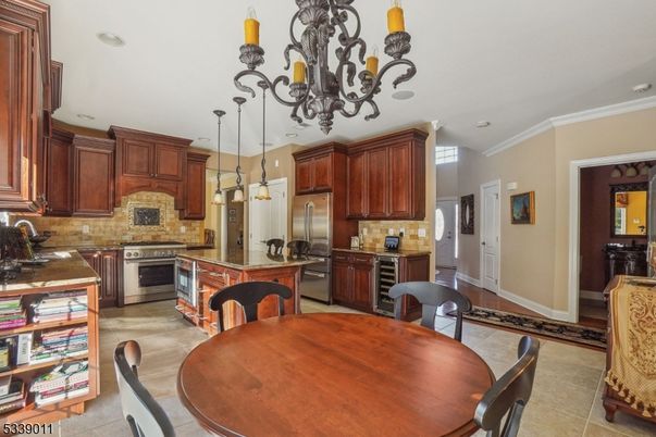 Chandelier, Dining room, Interior, Kitchen, Pendant Lights, Recessed Lighting, Stainless Steel Appliances