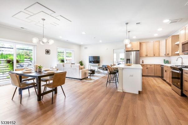 Dining room, Interior, Kitchen, Living room, Pendant Lights, Recessed Lighting, Stainless Steel Appliances, Wood Texture Flooring