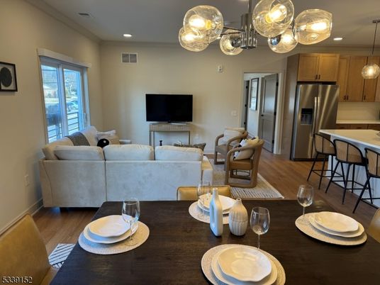 Dining room, Interior, Kitchen, Living room, Pendant Lights, Recessed Lighting, Stainless Steel Appliances, Wood Texture Flooring