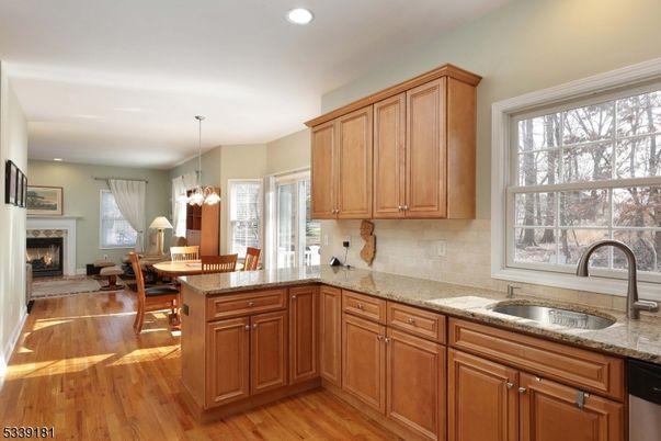 Dining room, Fireplace, Interior, Kitchen, Pendant Lights, Recessed Lighting, Wood Texture Flooring