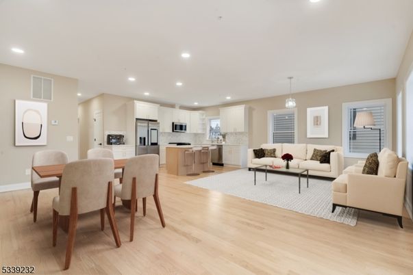Dining room, Interior, Kitchen, Living room, Pendant Lights, Recessed Lighting, Stainless Steel Appliances, Wood Texture Flooring