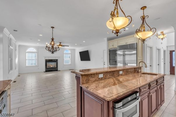 Chandelier, Fireplace, Interior, Kitchen, Pendant Lights, Recessed Lighting, Stainless Steel Appliances