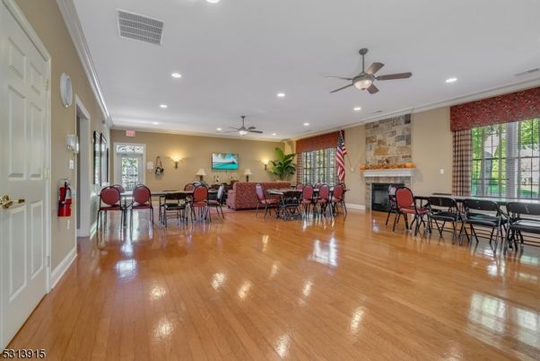 Dining room, Fireplace, Interior, Recessed Lighting, Stone Walls, Wood Texture Flooring