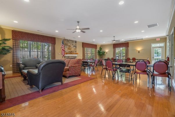 Dining room, Fireplace, Interior, Living room, Recessed Lighting, Wood Texture Flooring