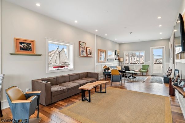 Dining room, Fireplace, Interior, Living room, Recessed Lighting, Wood Texture Flooring